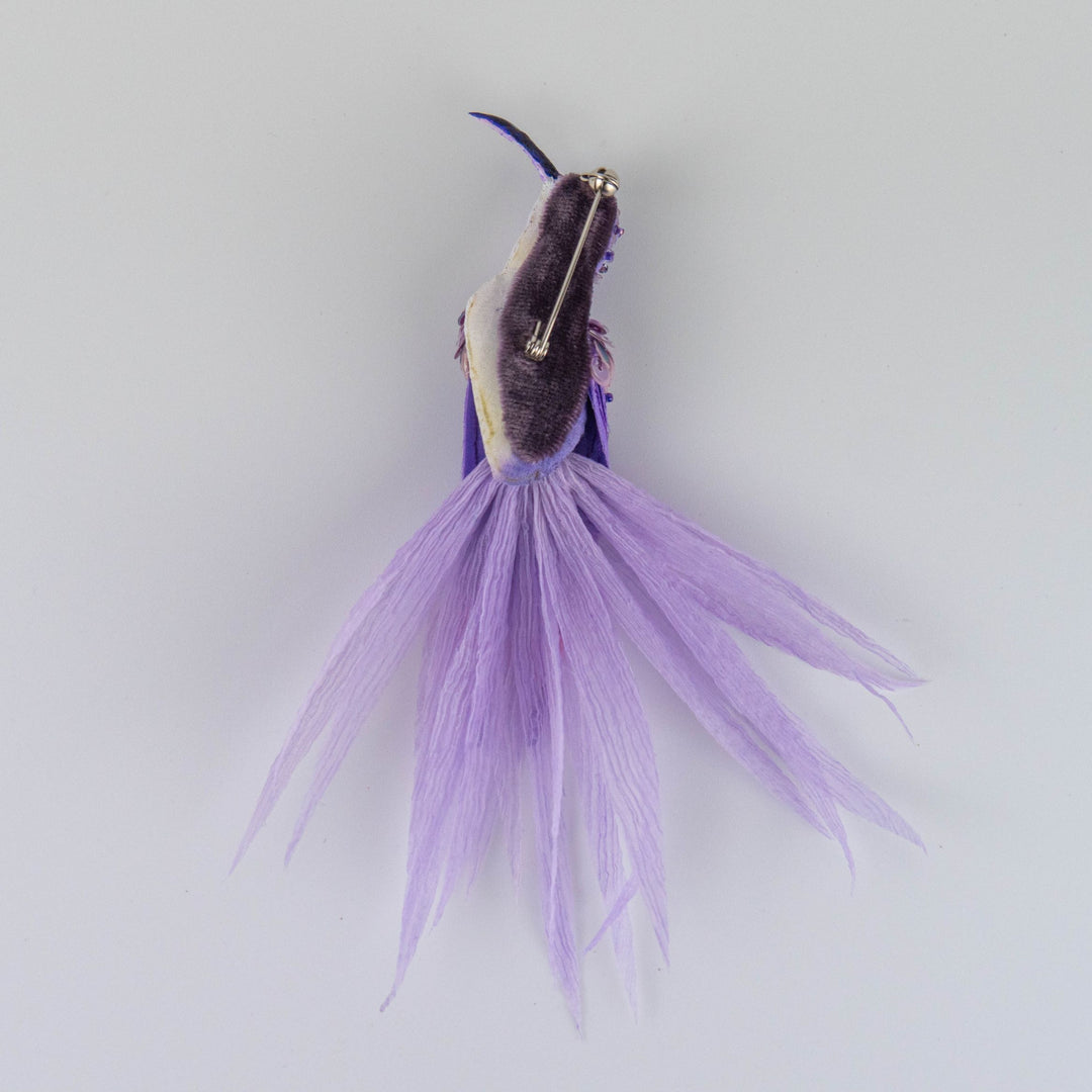 Side view showing pinback of embroidered hummingbird brooch in purple and white, unique handcrafted textile accessory from UK