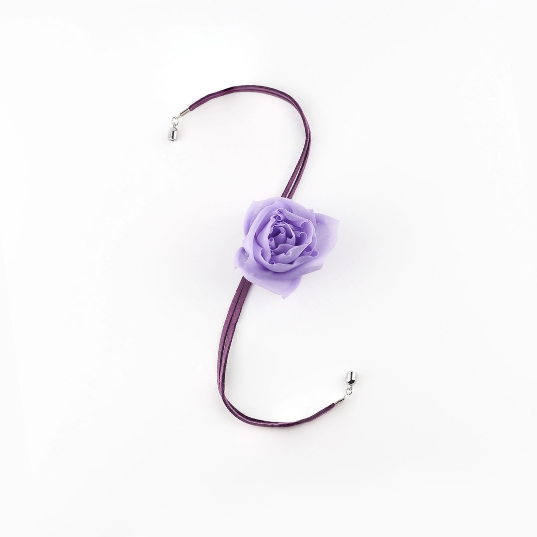 Handmade purple silk organza rose choker with suede lace and toggle clasp, displayed flat on a white background