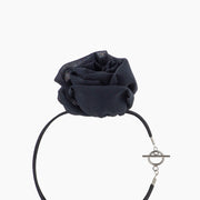 Side view of black silk chiffon rose choker necklace with toggle clasp, displayed on a white background.