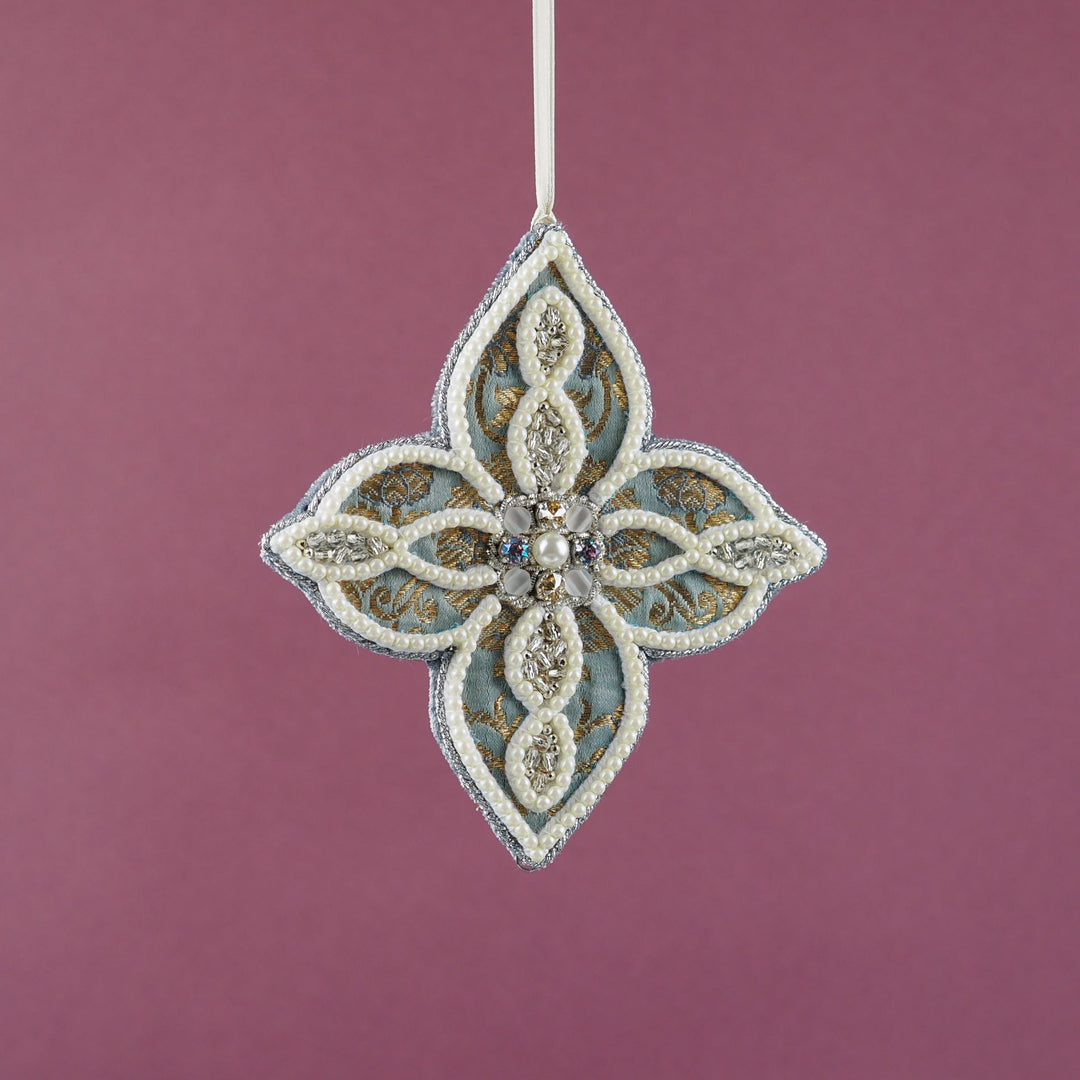Four-pointed snowflake ornament from the Jewels of Winter collection by Ksenia Semirova. Crafted with the pearl-setting technique on gold brocade fabric, featuring imitation pearls and neutral vintage crystals