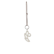 Front view of white and silver floral bag charm, handmade with seed beads, metallic cord, and suede strap