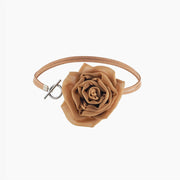  Front view of gold silk rose choker necklace showing suede lace and toggle clasp, centered rose in focus