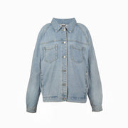 Front view of oversized light blue denim jacket with button closure, two chest pockets, and relaxed fit, displayed on a white background.