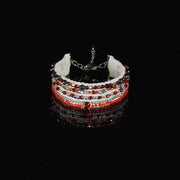Handmade red and white multi-strand beaded bracelet on textile base with glass beads and central rhinestone detail