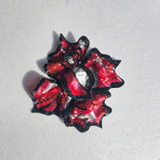 Front view of red and black hand-embroidered floral brooch by Ksenia Semirova, featuring sequins, beads, and silver details on silk organza
